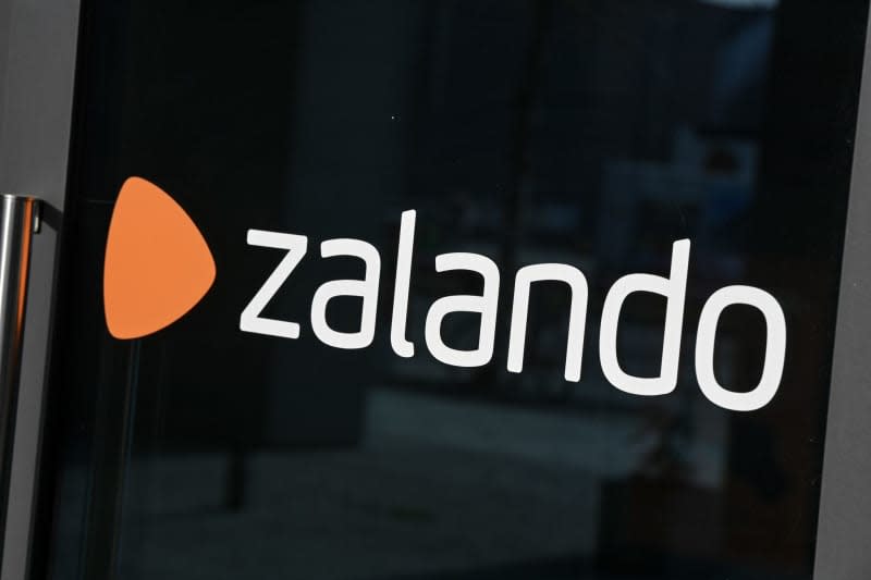 The logo of online retailer Zalando is pictured on the Zalando Campus at Mercedes-Platz in Berlin.  Earnings were up significantly in fiscal 2023 at Zalando, an online retailer of shoes, fashion and beauty products, the Berlin-based company reported on Wednesday. Jens Kalaene/dpa-Zentralbild/dpa