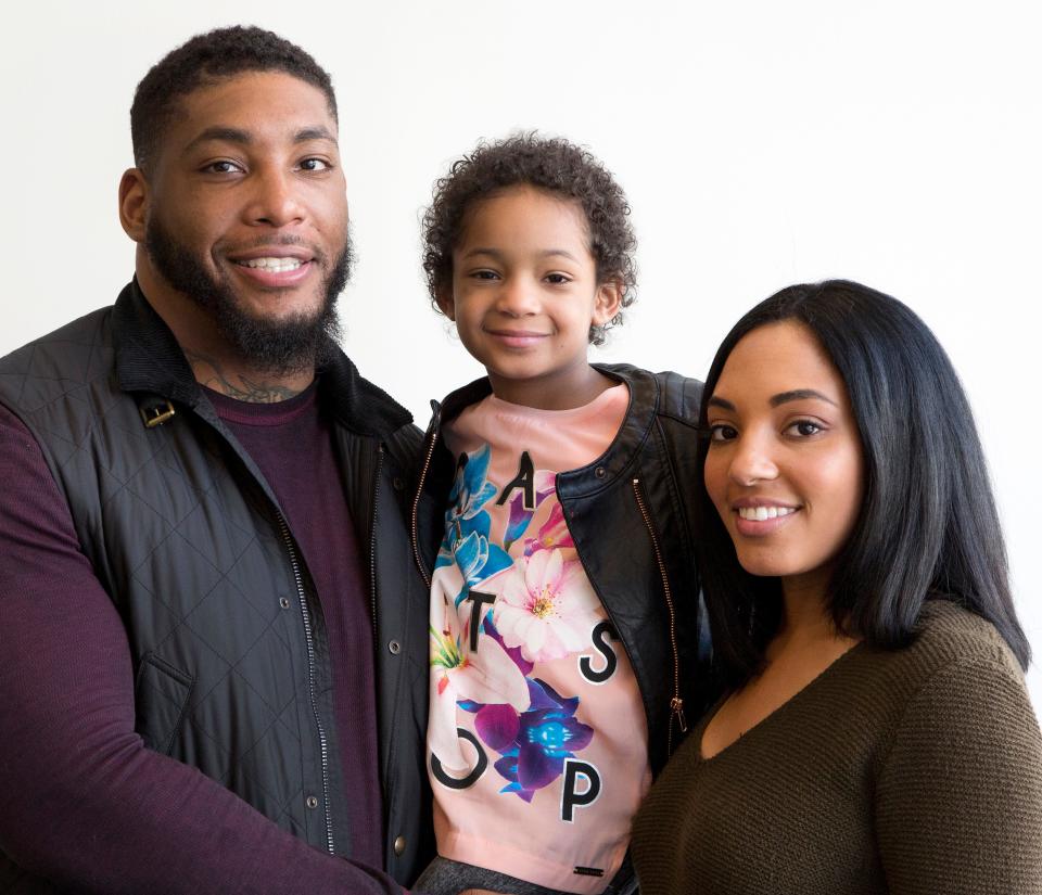 Devon Still and Asha Joyce pose with their daughter, Leah, then 5 in this 2016 photo.