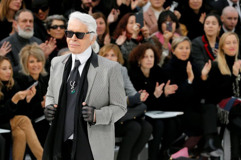 FILE PHOTO: German designer Karl Lagerfeld appears at the end of his Haute Couture Spring Summer 2015 fashion show for French fashion house Chanel in Paris