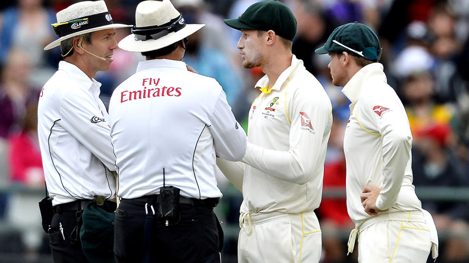 Cameron Bancroft and Steve Smith, pictured here speaking to umpires about the cheating attempts.