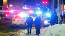 Police officers are seen near a mosque after a shooting in Quebec City. REUTERS/Mathieu Belanger