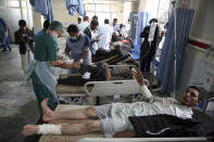 <p>Afghan Injured men receives a treatment at a hospital after a suicide attack in Kabul, Afghanistan, Saturday Jan. 27, 2018. (Photo: Rahmat Gul/AP) </p>