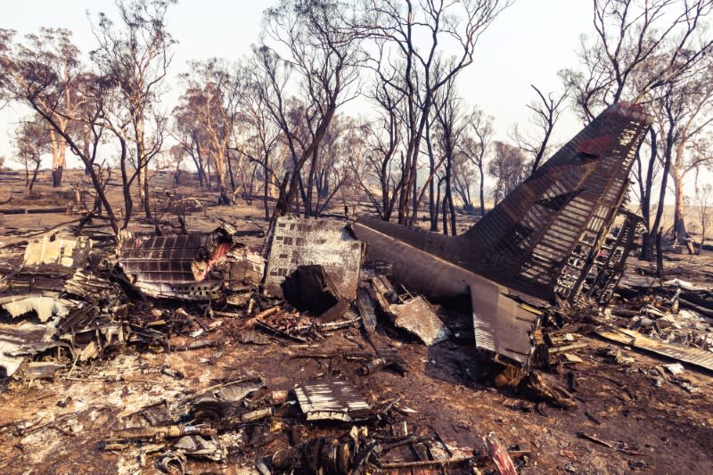 Debris seen following the crash of a C-130 air tanker plane after dropping fire retardant, in this January 24, 2020 picture obtained from social media, in Snowy Mountains, New South Wales, Australia