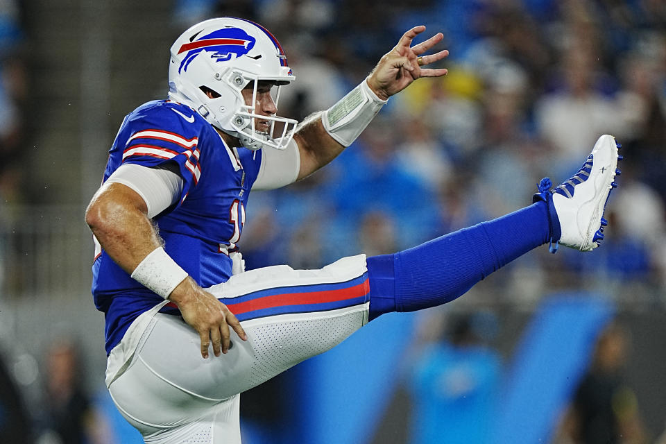 Buffalo Bills quarterback Matt Barkley punts during the second half of an NFL preseason football game against the Carolina Panthers on Friday, Aug. 26, 2022, in Charlotte, N.C. (AP Photo/Rusty Jones)