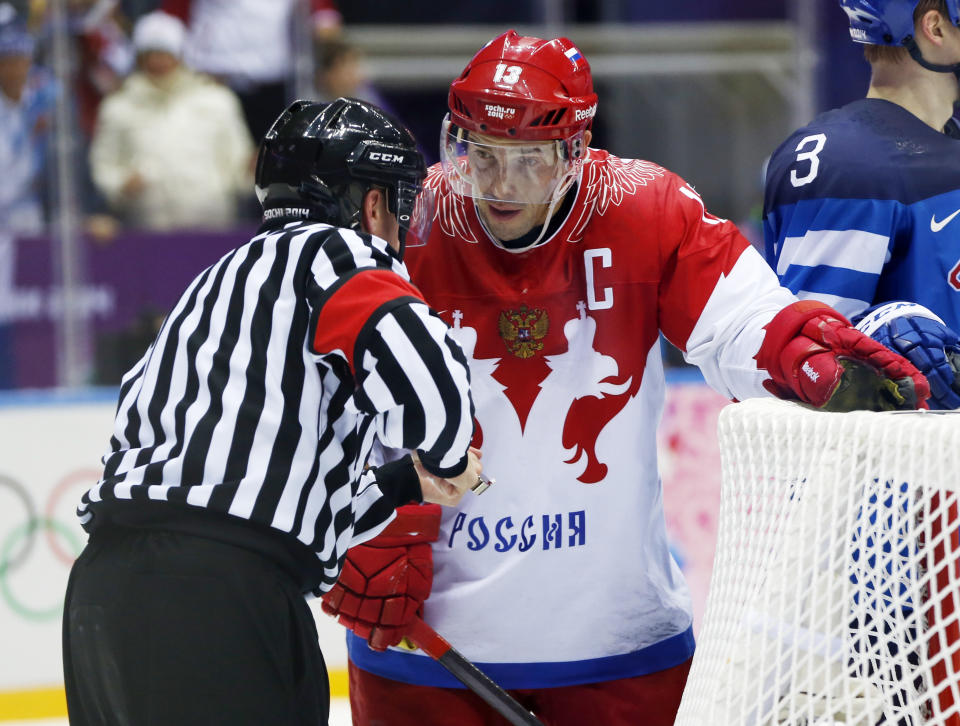 Russia forward Pavel Datsyuk appeals to an official in the third period of a men's quarterfinal ice hockey game against Finland at the 2014 Winter Olympics, Wednesday, Feb. 19, 2014, in Sochi, Russia. (AP Photo/Julio Cortez)