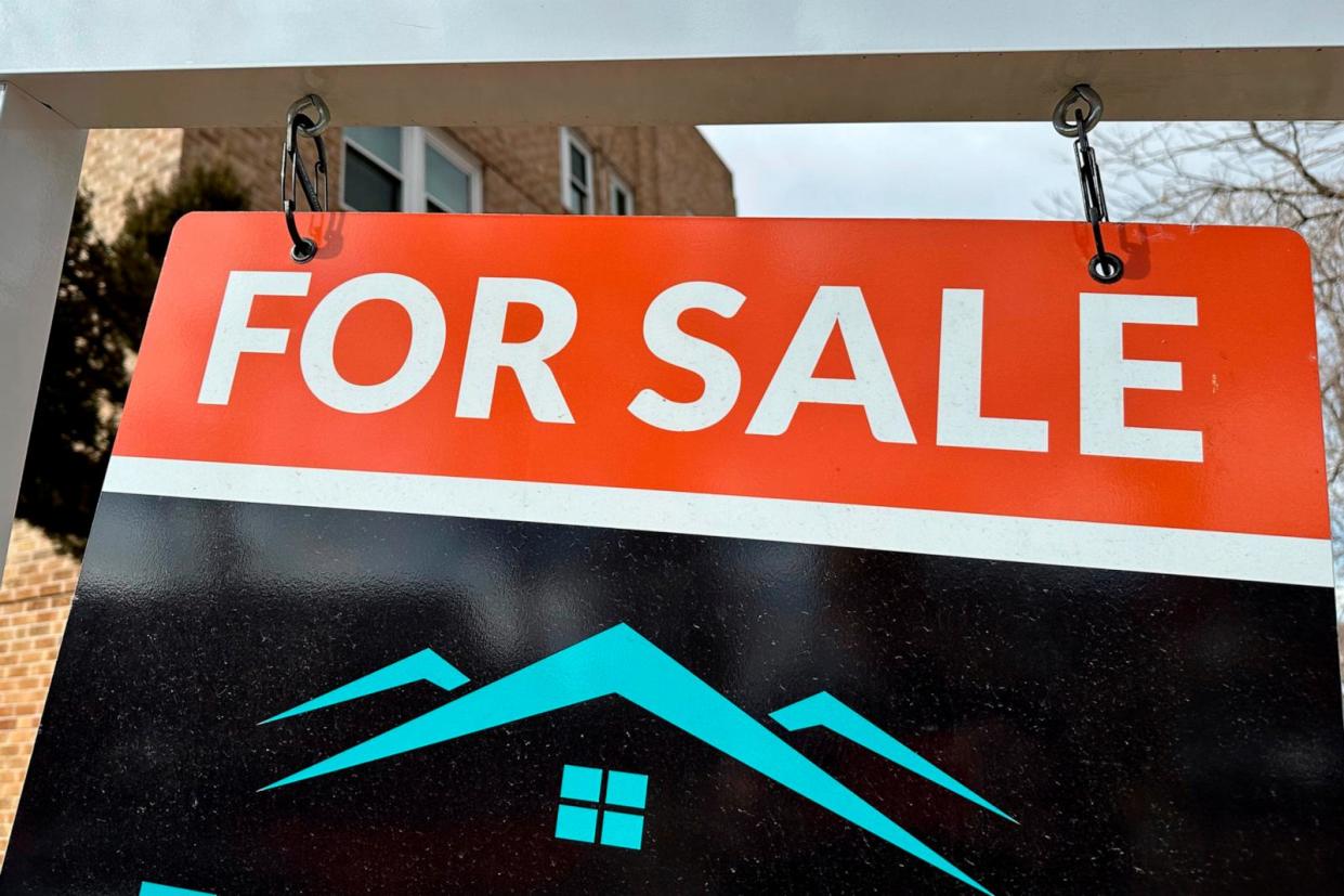 PHOTO: A sale sign stands outside a condominium on the market, Feb. 21, 2024, in Denver. (David Zalubowski/AP)