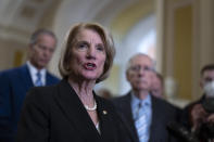 Sen. Shelley Moore Capito, R-W.Va., speaks to reporters following the Republican policy meeting, at the Capitol in Washington, Wednesday, March 20, 2024. (AP Photo/J. Scott Applewhite)