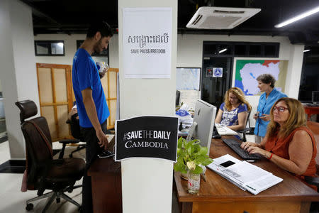 Journalists work at the newsroom of The Cambodia Daily newspaper in Phnom Penh, Cambodia, September 3, 2017. REUTERS/Samrang Pring