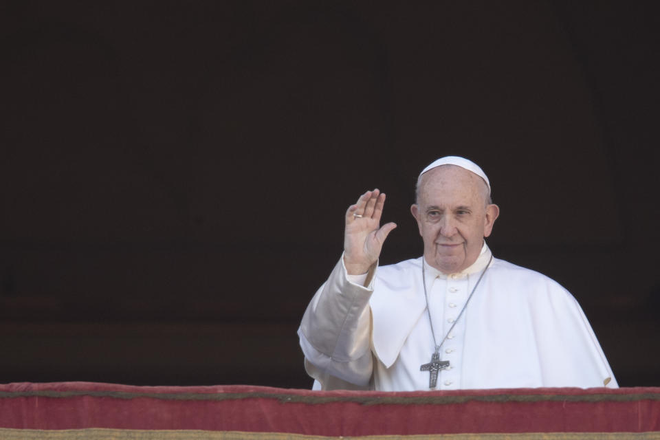 Pope Francis waves to faithful as he arrives to deliver the Urbi et Orbi (Latin for 'to the city and to the world' ) Christmas' day blessing from the main balcony of St. Peter's Basilica at the Vatican, Wednesday, Dec. 25, 2019. (AP Photo/Alessandra Tarantino)