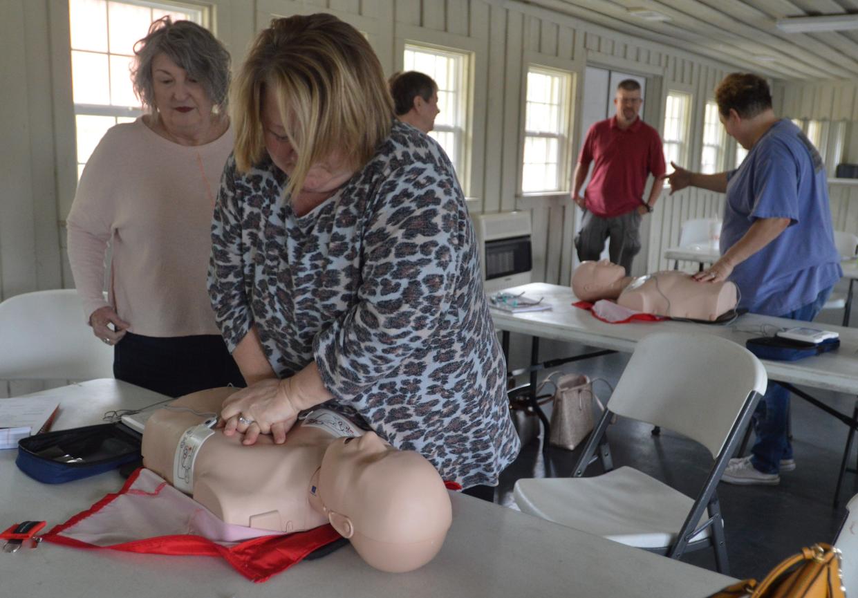 Glascock County officials train with new CPR manikins and AED training machines.
