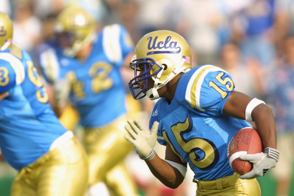 PASADENA, CA - NOVEMBER 10:  Running back Ed Ieremia-Stansbury #15 of the UCLA Bruins runs with the ball during the Pac-10 Conference football game on Novemver 10, 2001 against the Oregon Ducks at the Rose Bowl in Pasadena, California. The Ducks defeated the Bruins 21-20. (Photo by Jeff Gross/Getty Images)