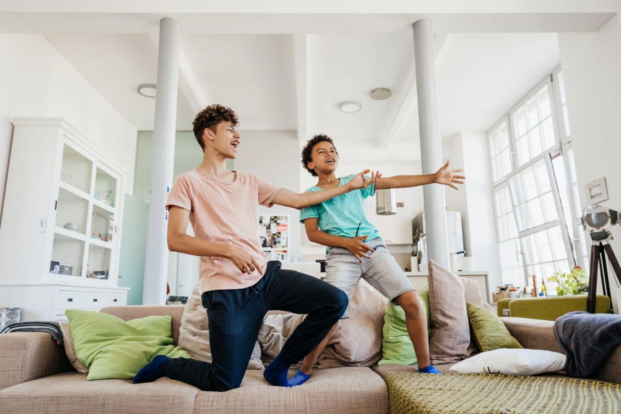 two brothers messing around at home together