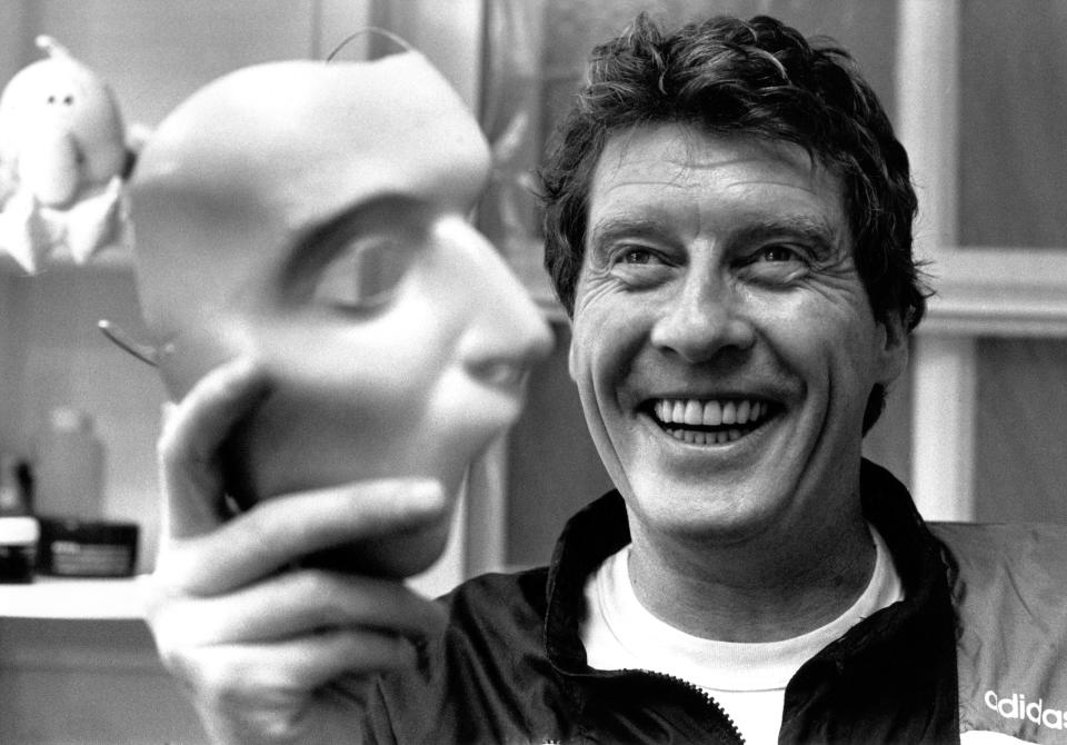 Michael Crawford holds the phantom mask for "The Phantom of the Opera"