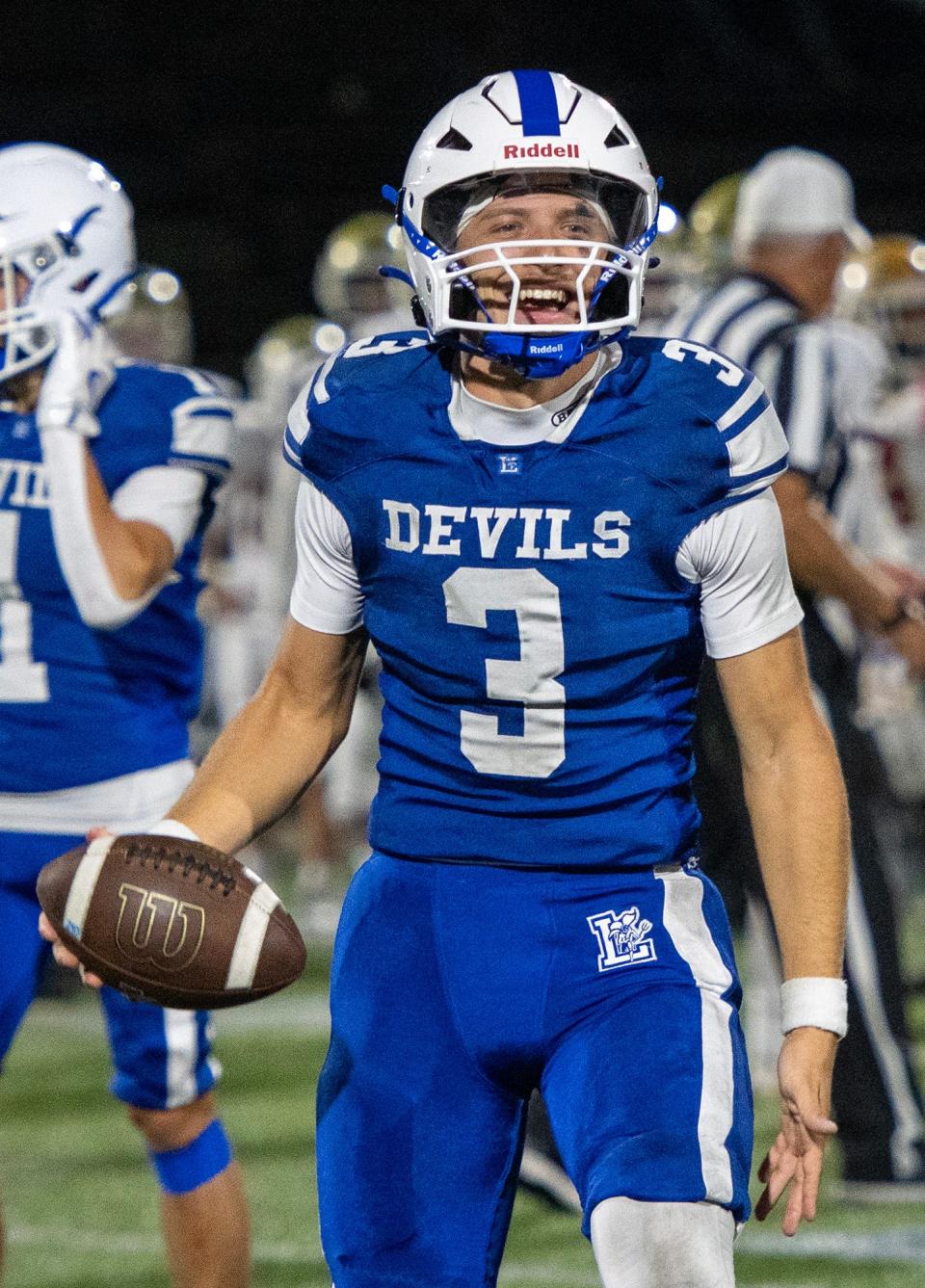 Leominster quarterback Osiris Lopez celebrates a win over against Doherty at Doyle Field Friday.