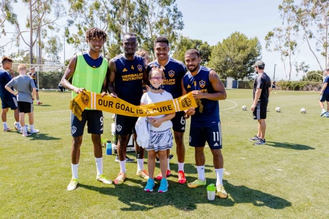 10-year-old Avery (center) meets with LA Galaxy players during practice at Dignity Health Sports Park during her Dream on 3 Sports Wish, in conjunction with MLS’s Kick Childhood Cancer Campaign on September 15, 2021.