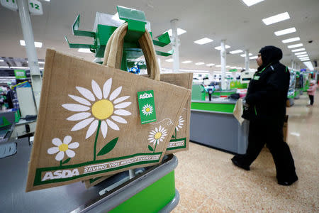 FILE PHOTO: Shopping bags are displayed at the Asda superstore in High Wycombe, Britain, February 8, 2017. REUTERS/Eddie Keogh/File Photo