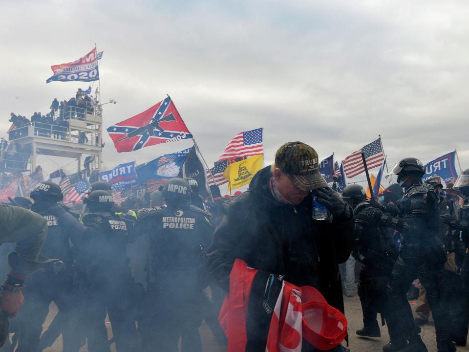 Trump supporters clash with police and security forces as people try to storm the US Capitol Building