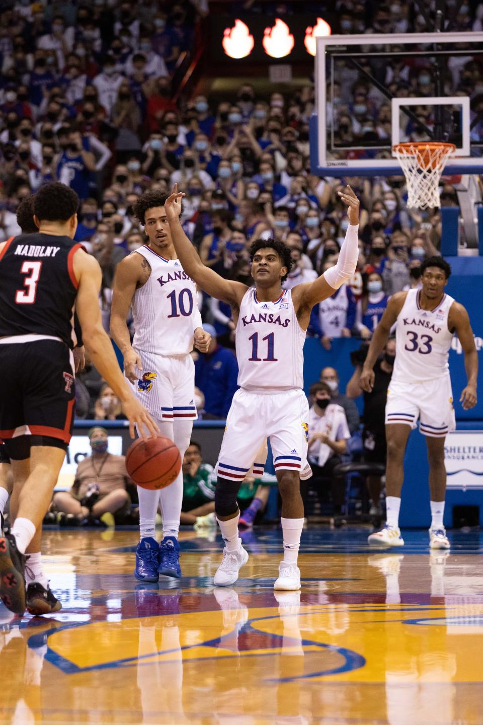 Kansas guard Remy Martin try to get the fans to make some noise during game against Texas Tech on Monday at Allen Fieldhouse.