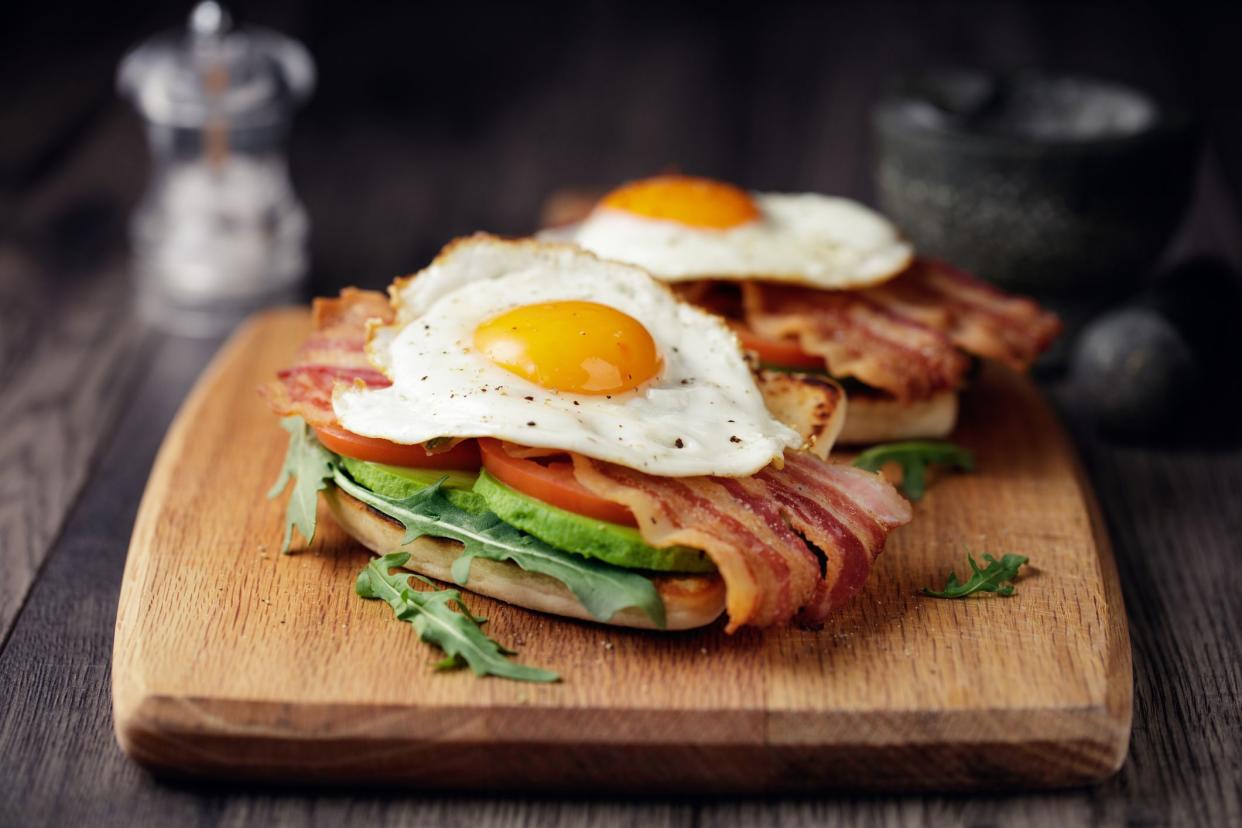 Home made freshness bacon,fried egg with avocado ,tomato and rocket leaves on fried soda bread