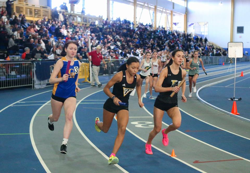 The field in the 4x800 meter relay, including Caesar Rodney's Madeline Francis (left) and Padua's Alessandra DeAscanis (right) takes off at the start during the DIAA indoor track and field championships at the Prince George's Sports and Learning Complex in Landover, Md., Saturday, Feb. 3, 2024. Padua claimed first, Caesar Rodney second, and Tatnall was third in the event.