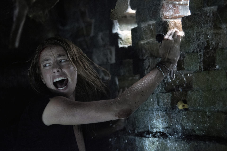 This image released by Paramount Pictures shows Kaya Scodelario in a scene from "Crawl." (Sergej Radović/Paramount Pictures via AP)