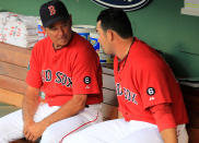 Bobby Valentine #25 of the Boston Red Sox chats with Adrian Gonzalez #28 of the Boston Red Sox before a game with the Kansas City Royals at Fenway Park on August 24, 2012 in Boston, Massachusetts. (Photo by Jim Rogash/Getty Images)