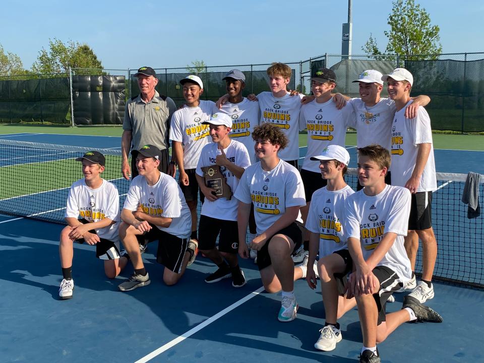 The Rock Bridge boys tennis team poses with the Class 3 District 4 trophy after beating Liberty-Wentzville 5-0 on Wednesday. The Bruins won their 21st straight district title.