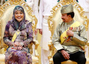 <div class="caption-credit"> Photo by: Wenn.com</div>The Sultan and his wife look happy. With 12 children from three wives and at least one already married, the Sultan, 66, may be looking forward to a day when he'll be done hosting weddings. This week's affair, despite being by no means budget, did away with a traditional procession through the capital in an open gilded Rolls Royce that was costly in terms of crowd control and security. <br>