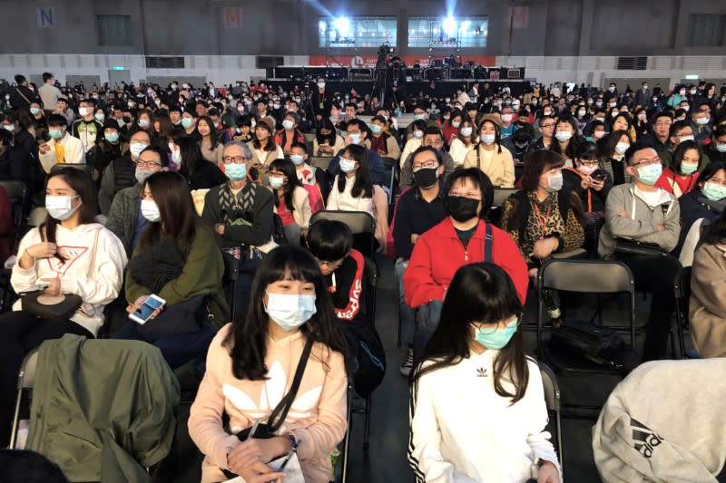 Foxconn employees wearing masks attend the company's year-end gala in Taipei