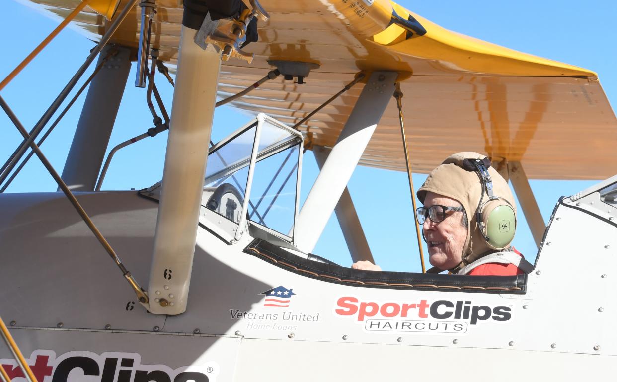 Barbara Waller, 81, felt free as she soared through the skies over Pineville in a restored World War II open cockpit Stearman bi-plane. The 20-minute flights for veterans at local nursing homes were made possible by Dream Flights and Central Management Company at Esler Field. Waller is an Army veteran.