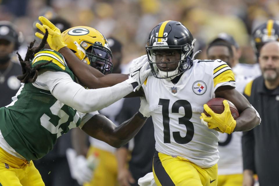 Pittsburgh Steelers' James Washington runs past Green Bay Packers' Za'Darius Smith during the first half of an NFL football game Sunday, Oct. 3, 2021, in Green Bay, Wis. (AP Photo/Matt Ludtke)