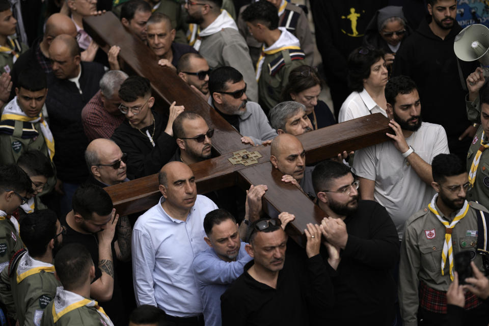 Christians walk the Way of the Cross procession that commemorates Jesus Christ's crucifixion on Good Friday, in the Old City of Jerusalem, Friday, March 29, 2024. (AP Photo/Leo Correa)