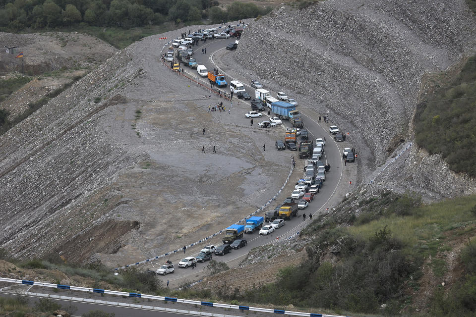 FILE - A convoy of cars of ethnic Armenians from Nagorno-Karabakh move to Kornidzor in Syunik region, Armenia, Sept. 26, 2023. Thousands of Nagorno-Karabakh residents are fleeing their homes after Azerbaijan's swift military operation to reclaim control of the breakaway region after a three-decade separatist conflict. (AP Photo/Vasily Krestyaninov, File)