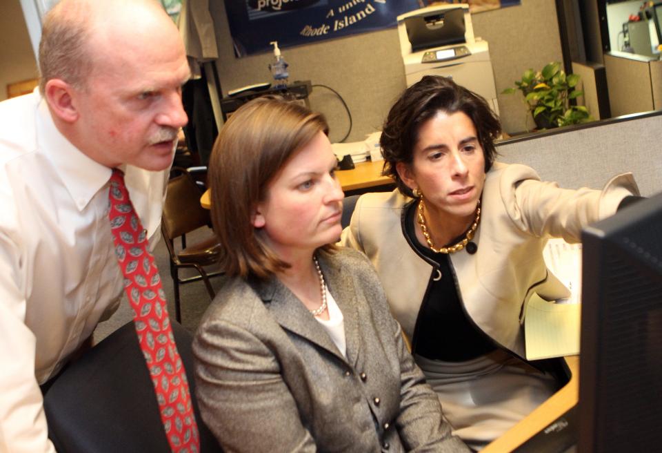 Joy Fox pictured in 2011 with then-state Treasurer Gina Raimondo.