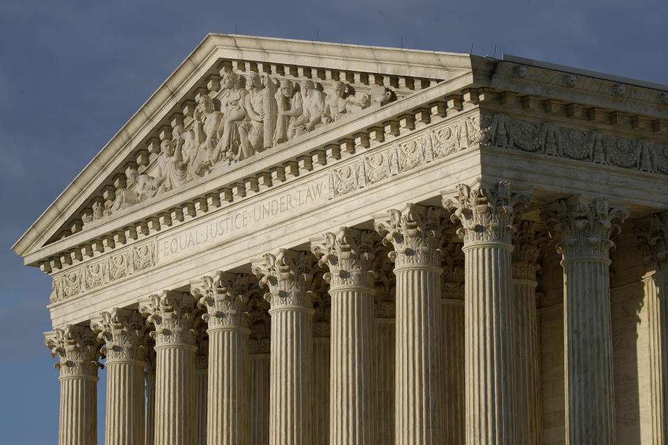 In this May 3, 2020 photo, the setting sun shines on the Supreme Court building on Capitol Hill in Washington. (AP Photo/Patrick Semansky)