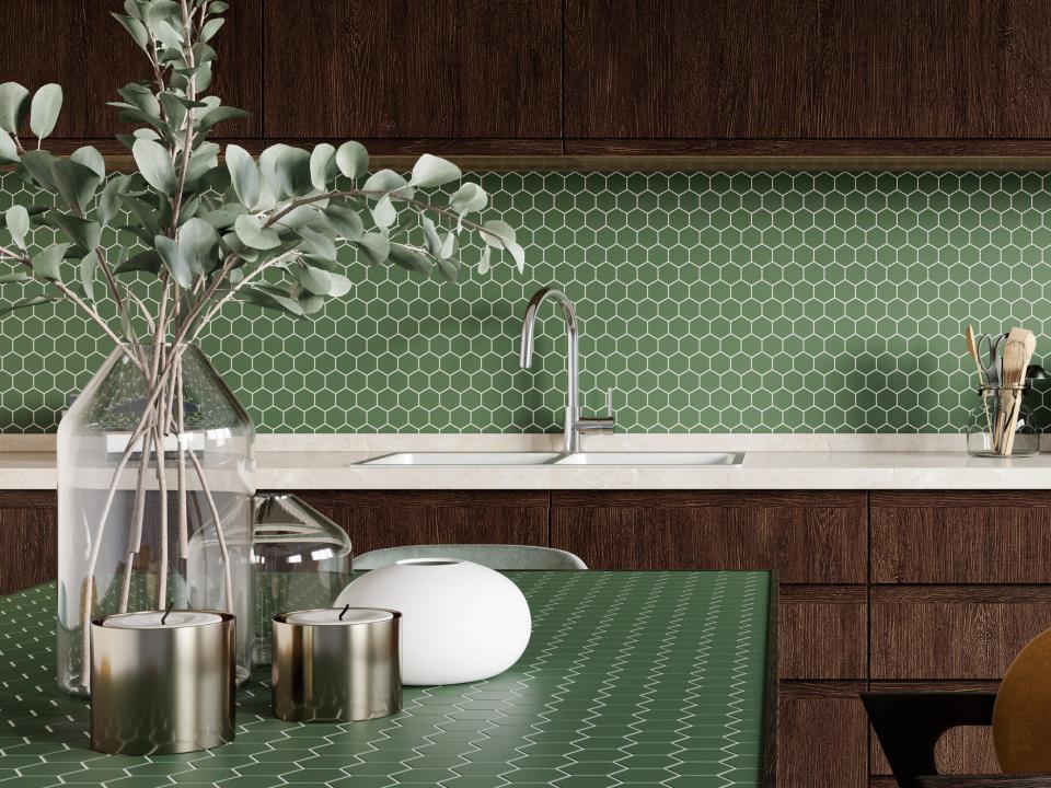 modern kitchen with green backsplash and table and dark wood cabinets