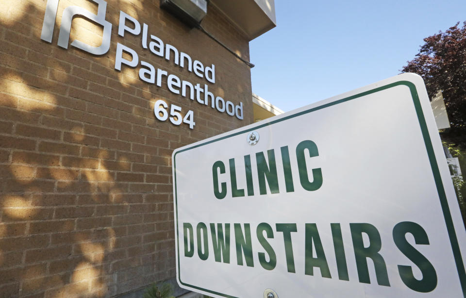 FILE - In this Aug. 21, 2019, file photo, a sign is displayed at Planned Parenthood of Utah in Salt Lake City. An appeals court is considering whether to block a Trump administration rule that bans taxpayer-funded health clinics from referring patients for an abortion, a rule that has already prompted many providers, including Planned Parenthood, to leave a longstanding federal family planning program. Eleven judges from the 9th U.S. Circuit Court of Appeals in San Francisco heard arguments Monday, Sept. 23, 2019, in challenges brought by 22 states as well as Planned Parenthood and other organizations. (AP Photo/Rick Bowmer, File)