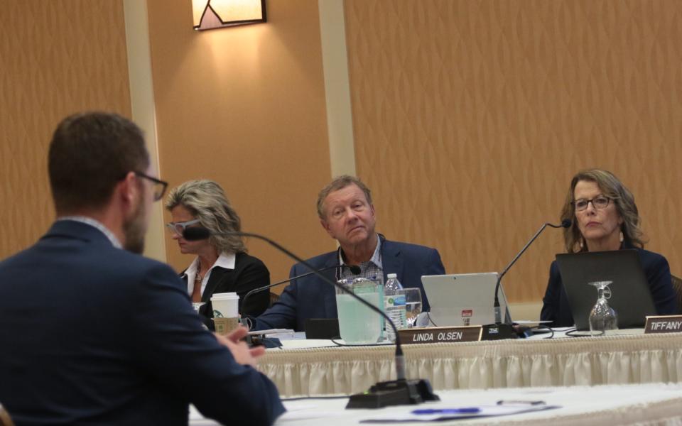 Rich Meyer and Linda Olson, board members for the South Dakota Board of Education Standards, listen to testimony Monday in the first of four public hearings on the proposed social studies content standards.