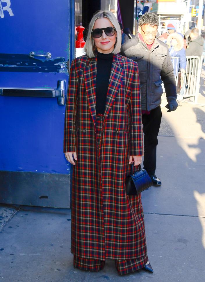 Kristen Bell in a tartan coat and matching pants