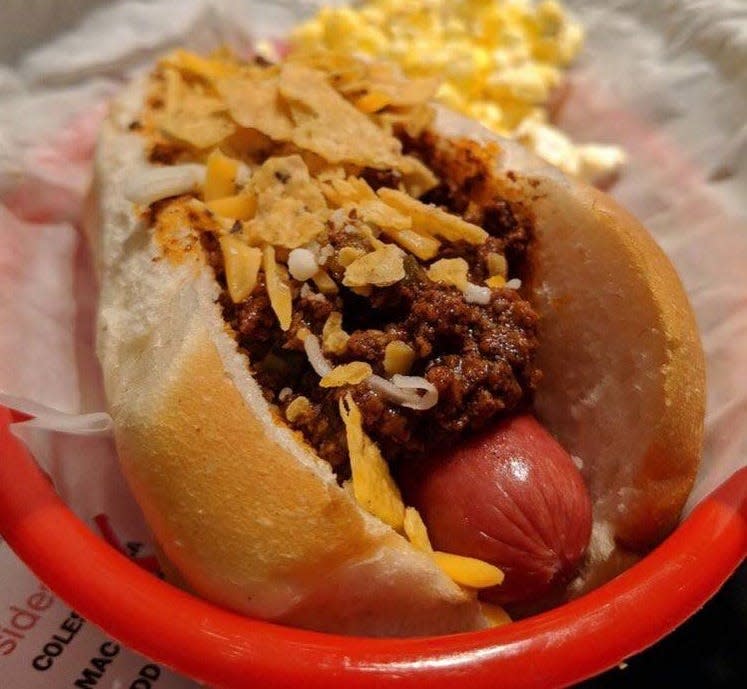 Jill’s Cowboy hot dog with chili, cheddar cheese, jalapeños and crumbled corn chips from Designer Dawgs.