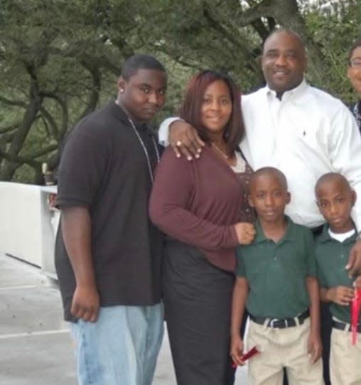 Troy Nellums is shown here with his family, including his twin sons whose tuition he would eventually subsidize with parent PLUS loans.