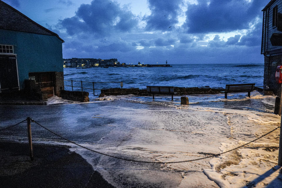 ST IVES, ENGLAND - APRIL 09: Floodwater spreads across the street in the early morning on April 09, 2024 in St Ives, Cornwall, England. On Monday, the Met Office issued severe weather warnings for wind across the southern and western coasts of England and Wales, effective until Tuesday afternoon. This follows the turbulent weather over the weekend, when Storm Kathleen, combined with high tides, generated massive waves along the Cornish coast. (Photo by Hugh Hastings/Getty Images)