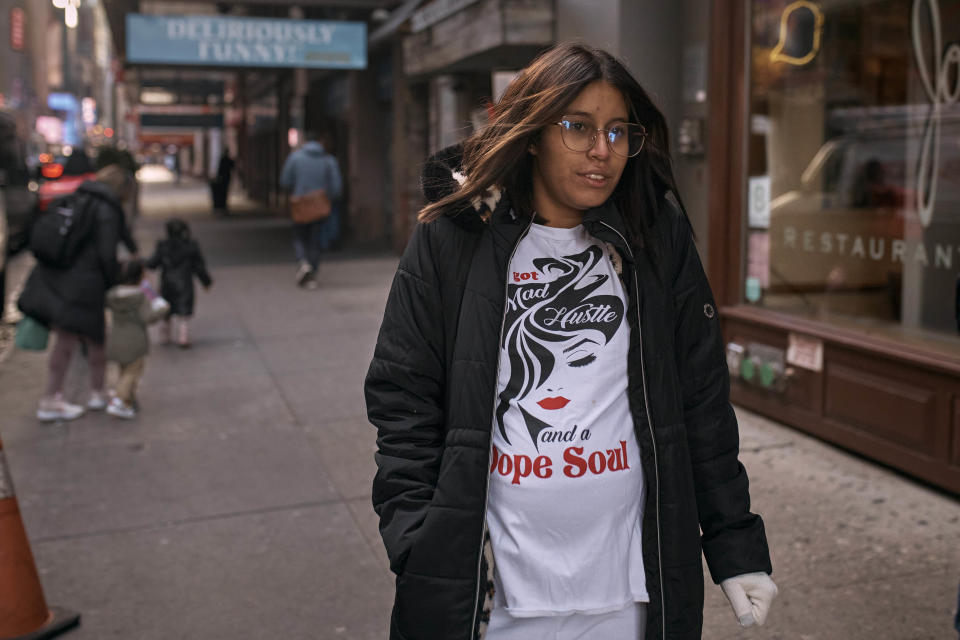 Migrant Ana Vasquez, 22 years old, from Venezuela, who is eight months pregnant walks near the Row Hotel that serves as migrant shelter on Friday, Dec. 8, 2023, in New York. It could be a cold, grim New Year for thousands of migrant families living in New York City’s emergency shelter system. With winter setting in, they are being told they need to clear out, with no guarantee they’ll be given a bed elsewhere. (AP Photo/Andres Kudacki)