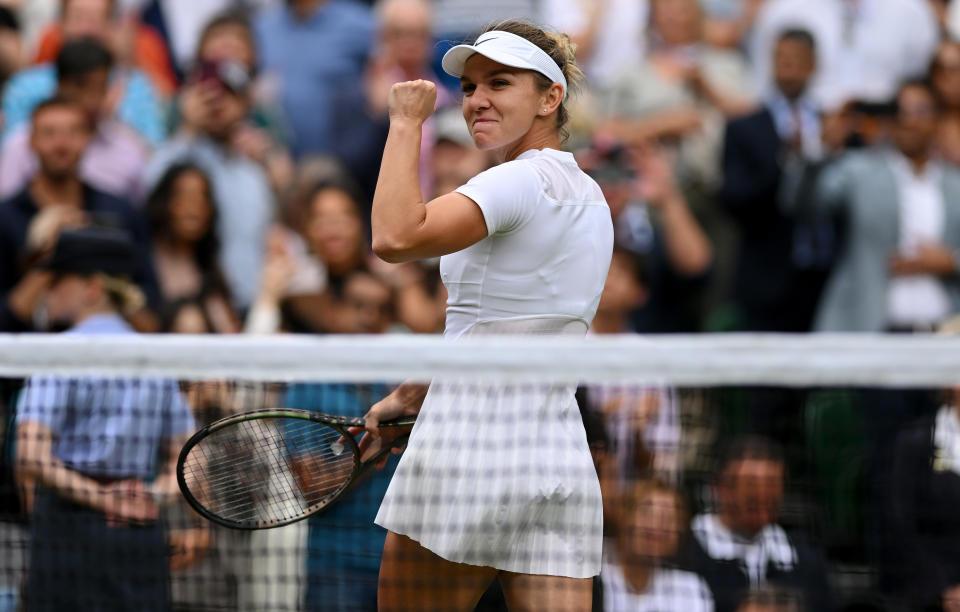 LONDON, ENGLAND - JULY 06: Simona Halep of Romania celebrates winning match point against Amanda Anisimova of The United States during their Women's Singles Quarter Final match on day ten of The Championships Wimbledon 2022 at All England Lawn Tennis and Croquet Club on July 06, 2022 in London, England. (Photo by Shaun Botterill/Getty Images)