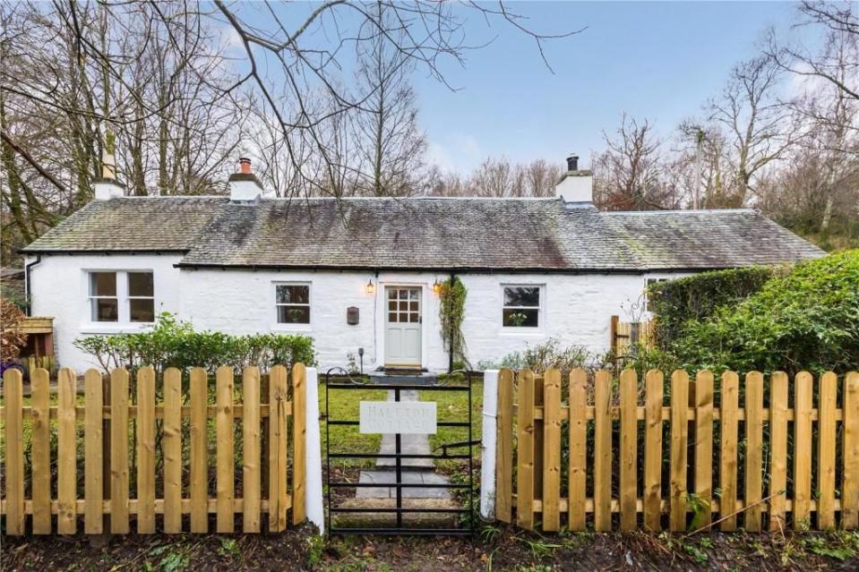 <p>Rounding off the top five is this white-washed cottage in Loch Lomond, Argyll and Bute. Situated in a picturesque village, it dates back to the 1800s and has been extensively renovated by the current owners.</p><p>Rightmove say: 'The <a href="https://www.housebeautiful.com/uk/cottages-for-sale/" rel="nofollow noopener" target="_blank" data-ylk="slk:cottage;elm:context_link;itc:0;sec:content-canvas" class="link ">cottage</a> is filled with features designed to give it a sense of warmth and comfort, including a spacious kitchen and large open fireplace.'</p><p>This property is currently on the market for £300,000 with Slater Hogg & Howison via <a href="https://www.rightmove.co.uk/properties/117990548#/" rel="nofollow noopener" target="_blank" data-ylk="slk:Rightmove;elm:context_link;itc:0;sec:content-canvas" class="link ">Rightmove</a>. </p><p><strong>Follow House Beautiful on <a href="https://www.instagram.com/housebeautifuluk/" rel="nofollow noopener" target="_blank" data-ylk="slk:Instagram;elm:context_link;itc:0;sec:content-canvas" class="link ">Instagram</a>.</strong><br></p>