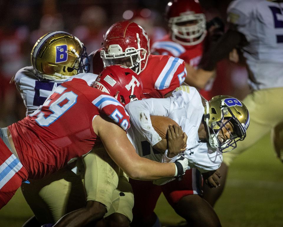 Frostproof (59) Harper Henson tackles Booker(2) Will Carter jr during first half action  In Frostproof  Fl  Friday November 11,2022.Ernst Peters/The Ledger