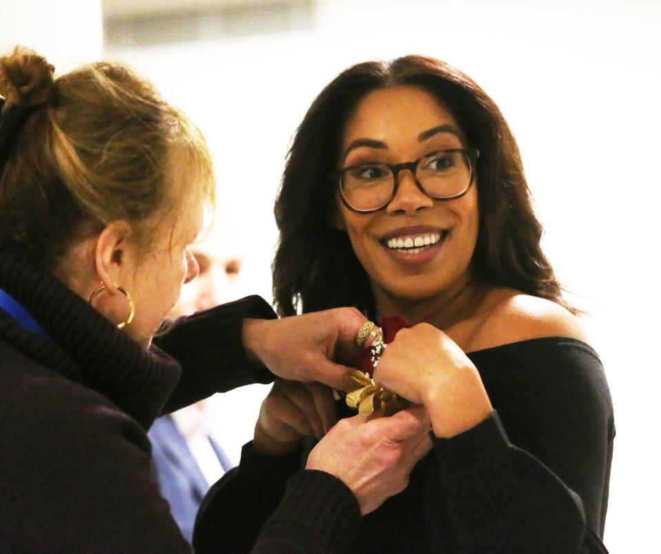 Portsmouth Assistant Mayor Joanna Kelley gets a corsage pinned before the inauguration and swearing-in ceremony for city elected officials Tuesday, Jan. 2, 2024.