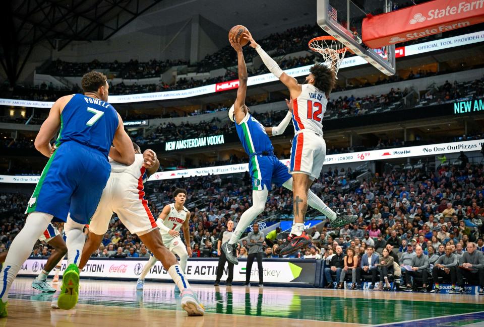 Pistons forward Isaiah Livers blocks a shot by Mavericks guard Jaden Hardy during the second quarter on Monday, Jan. 30, 2023, in Dallas.