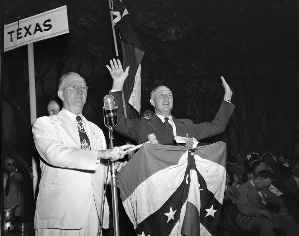 South Carolina Gov. Strom Thurmond raises his hands over his head in response to a tumultuous ovation accorded him by delegates to the Dixiecrats’ States’ Rights Convention in Birmingham, Ala., on July 17, 1948. (Photo: AP)