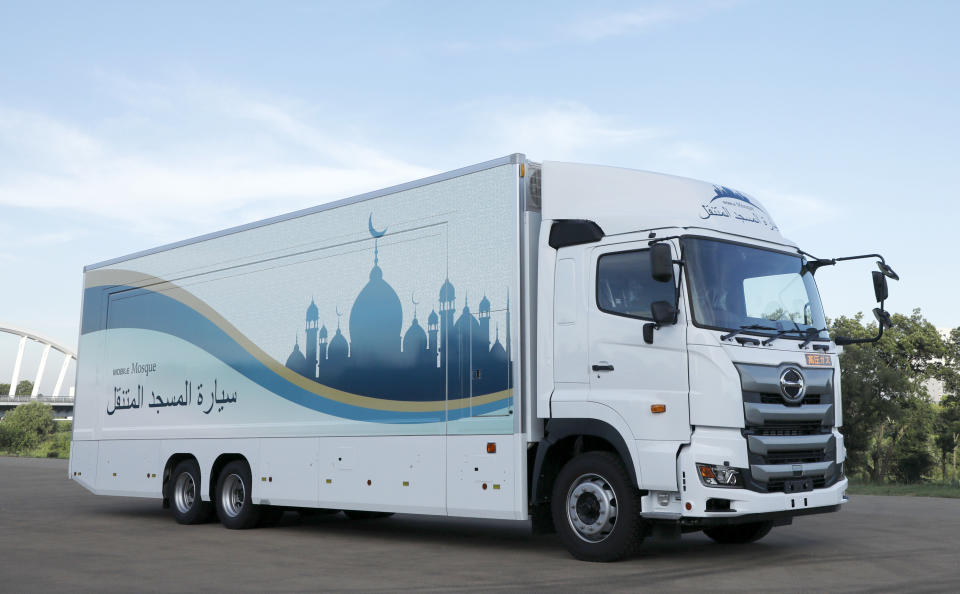 This July 23, 2018, photo provided by Mobile Mosque Executive Committee, shows Mobile Mosque, a mosque on wheels with the capacity for up to 50 people at Toyota Stadium in Toyota, western Japan. As Japan prepares to host visitors from around the world for the Summer Olympics in 2020, a Tokyo sports and cultural events company has created a mosque on wheels that its head hopes will make Muslim visitors feel at home. (Mobile Mosque Executive Committee via AP)